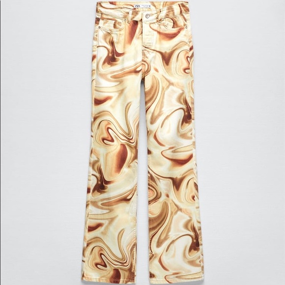 Zara Denim - Mid rise jeans with five pockets and straight legs. Front button closure.